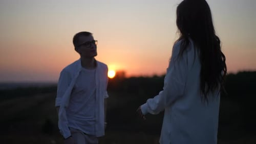 View From Back of Unrecognizable Young Woman to Romantic Couple in Love Walking Toward Each Other