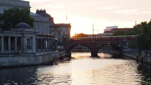 City view of the river and bridge at sunset.