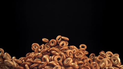 The Steering Wheel Crackers Rise and Fall on a Black Background Filmed on a Highspeed Camera at 1000