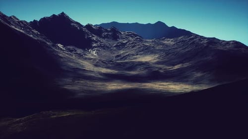 Majestic Mountain Landscape Under Clear Blue Sky at Midday