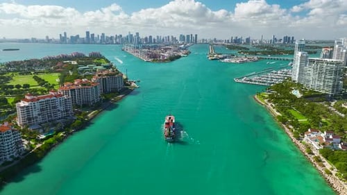 Commercial Container Ship Entering Miami Port Harbor Through Main Channel Near South Beach