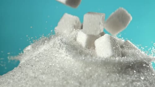 Cubes of Refined Sugar Fall Into a Pile of Sugar Filmed on a Highspeed Camera at 1000 Fps