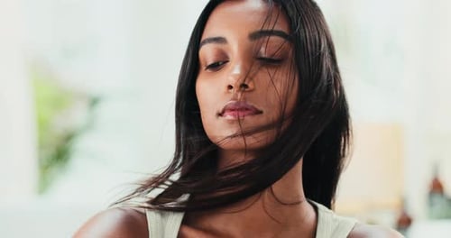 Beautiful Woman with Flowing Hair Looks to Side