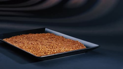 Close Up Buckwheat Lies on Blackblue Background on a Black Long Flat Plate Ukrainian Culture Light