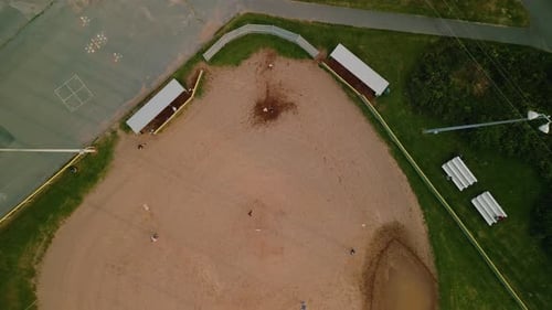Baseball Field with Players in Uniform Playing the Game of Baseball