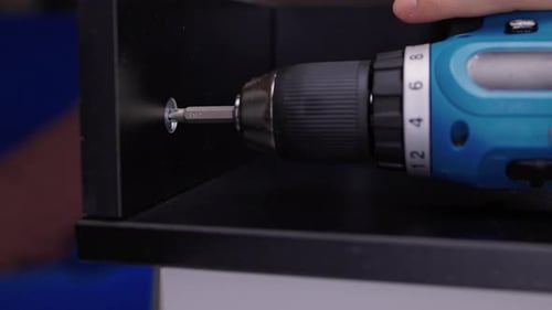 Screwing in Screw With Drill in Slow Motion