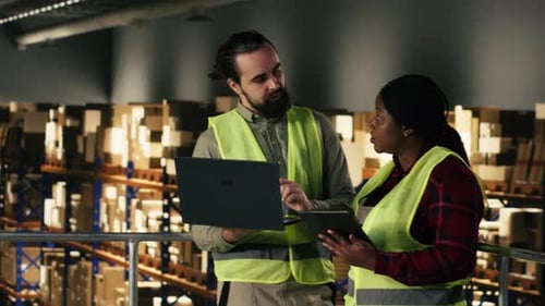Multiethnic Colleagues Laptop and Tablet Fulfillment Center Teamwork