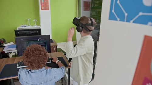 Children learning coding and virtual reality in classroom