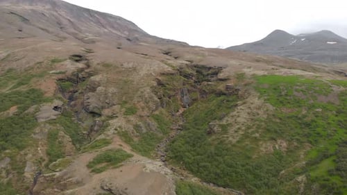 Aerial shot Mountain panorama, volcanic landscape and river, glacier river from above, river arms