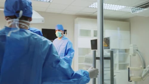 Surgeons Around Patient in Hospital Operating Room