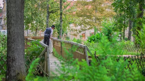 Beautiful wedding couple on the wooden bridge near the river.