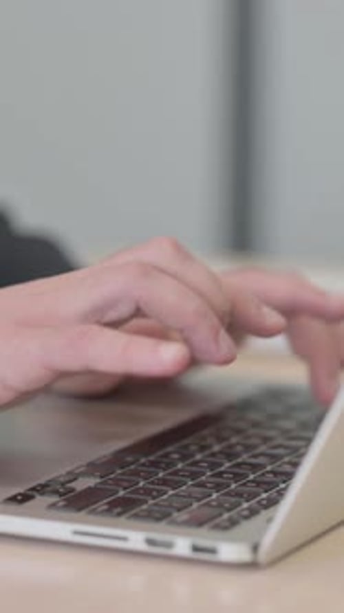 Close up of Businessman Typing on Laptop, vertical video