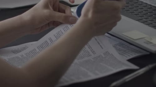 Adult Reviews Document at Workstation