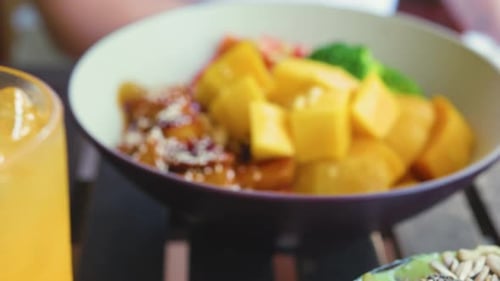 Bowl of Fruit and Vegetables With Yellow Drink