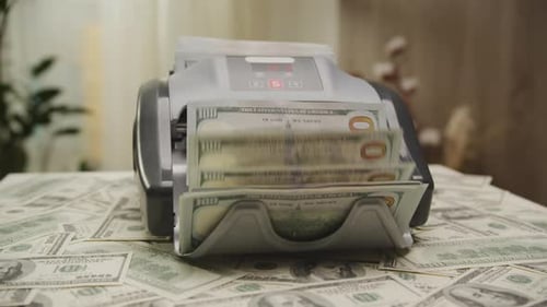 Currency Counter Machine Processing Dollar Bills