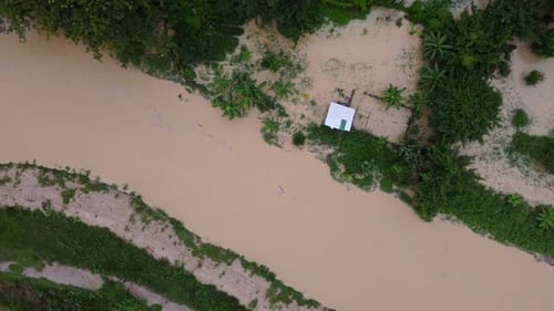 Aerial View of River Flooding Tropical Landscape