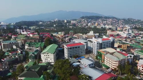 Aerial drone shot of housing in the big city with mountain in the background