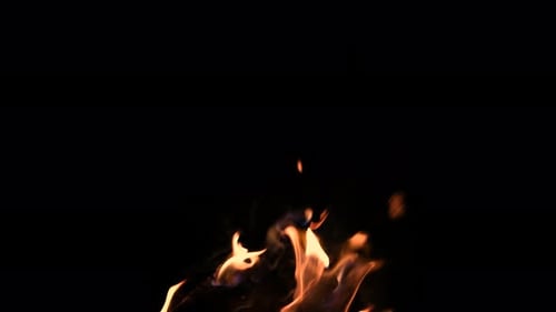 Intense fire flames dancing against black background