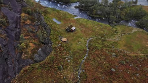 Dramatic aerial of rugged cabin in the mountains of Norway