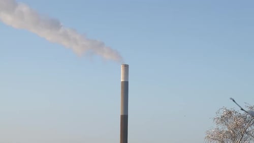 Climate change air pollution concept. Carbon dioxide emissions released from the chimney of a power