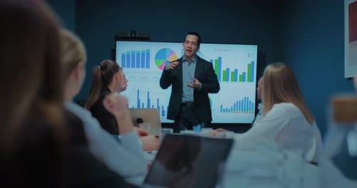 Multi Ethnic Business Team Meeting in Office and Listening to Financial Analyst Man Prores