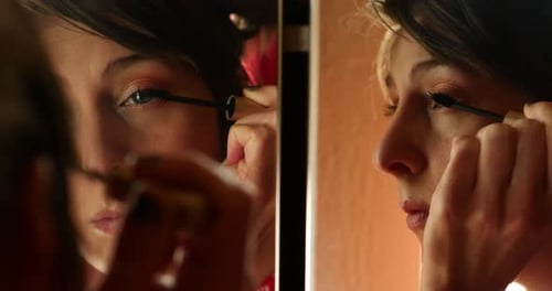Warm natural light clip of beautiful young early to mid 20s or 30s blue eyed women lady girl putting