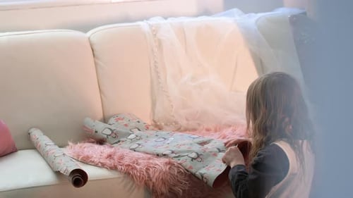 Girl Wrapping a Gift for the Holidays