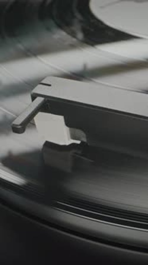 Vinyl Record Rotating Stylus Needle Touching Grooves Playing Sound on Vinyl Record Player