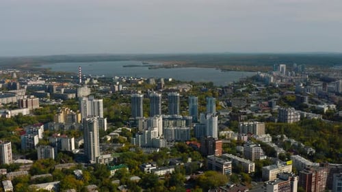 City with Highrise Buildings on Background of Lake and Green Forest Stock Footage Modern Buildings