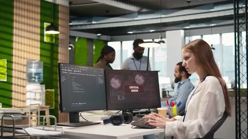 Female Programmer in Startup Office Struggling to Fix Application Errors