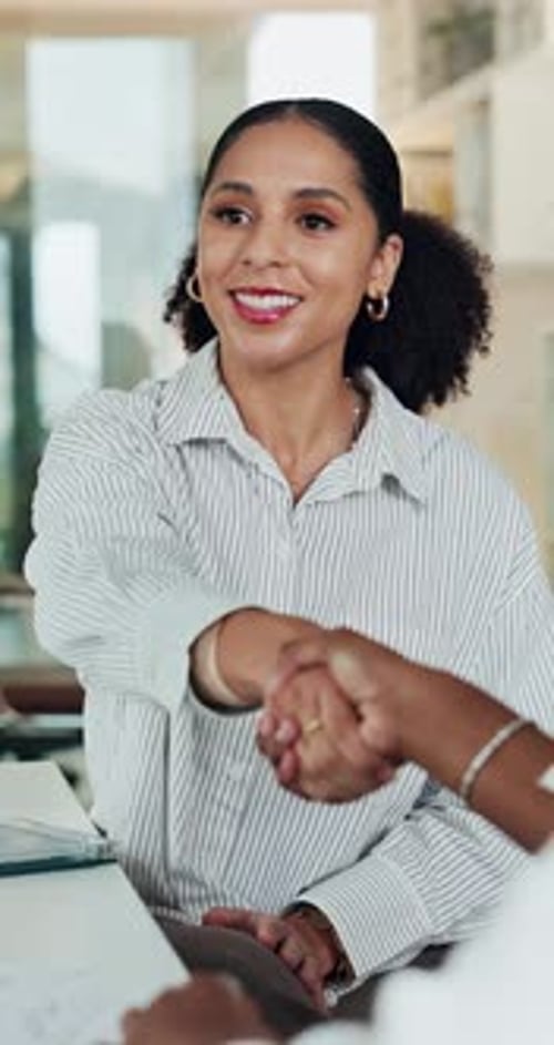 Business, handshake and woman with documents, partnership and achievement with agreement