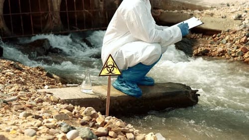 Ecologists sample water contaminated with dangerous, waterhazard toxins into tubesToxic32
