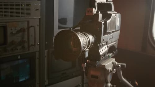 Video Camera on Tripod in TV Production Truck in Hazy Day Light