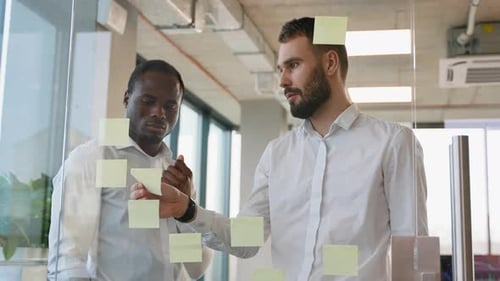 Brainstorming Concept Two Men Meeting at Office and Use Post It Notes to Share Idea Sticky Note on