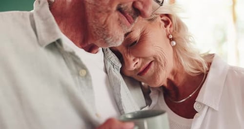 Senior Couple Embracing with Affection at Home