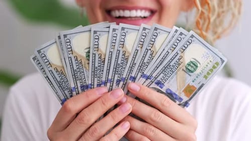 Excited Smiling Woman Showing Cash Money 1000 American Dollars Banknotes Hands with Money Close Up