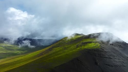 Flying Through Clouds Above Hills Cowered With Green Grass Paradise Heaven Mountain Range With High