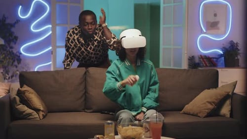 Woman Playing Virtual Reality Game with Friend