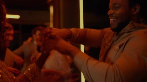 African American Couple Dancing On Party In Bar. Happy African Man And Woman Having Fun In Nightc...