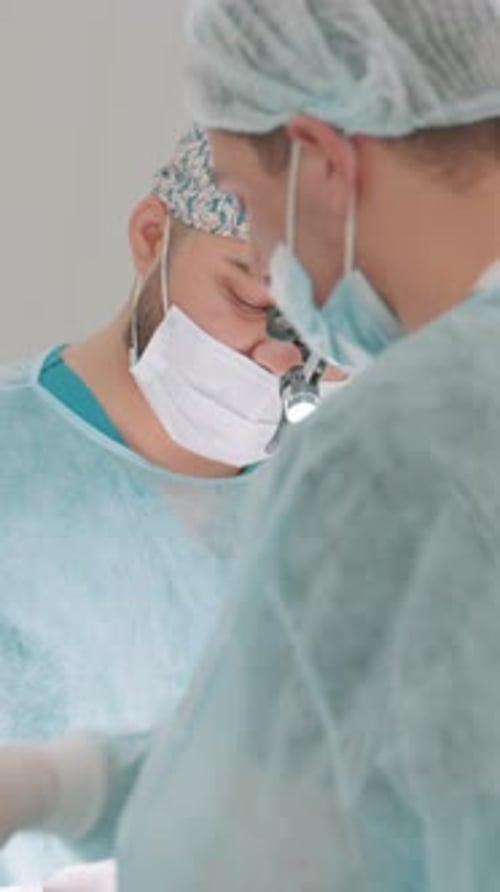 Surgeons Performing a Procedure in Hospital Operating Room