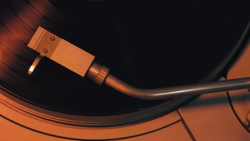 Retro Record Player Arm on Vinyl Record
