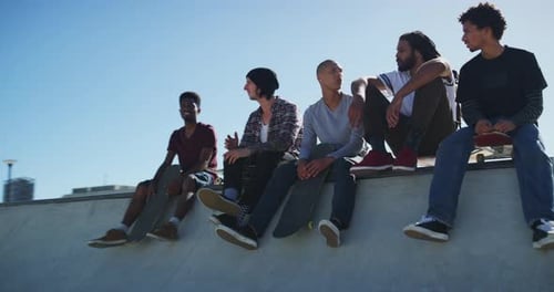 Friends, talking and men with skateboard in city for exercise, practice and hobby activity in town
