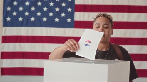 Woman Voting in Front of American Flag