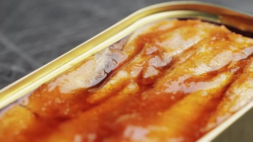 Opening Canned Sardine Fish Can Man Open the Canned Seafood on the Table Close Up on Professional
