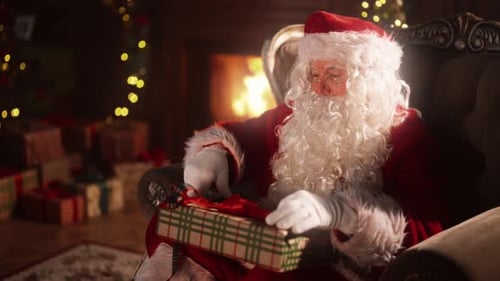 Santa Claus Unwrapping a Christmas Gift