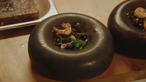 Chef Plating Gourmet Shrimp and Noodle Dish