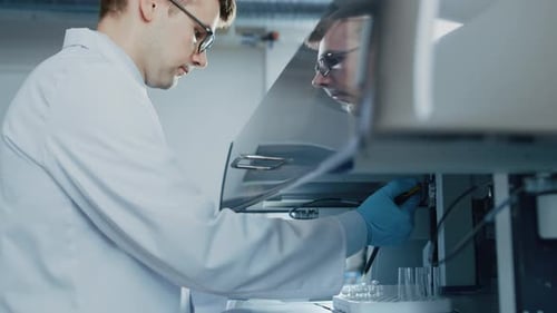 Research Scientist Uses Micro Pipette while Working with Test Tubes. Innovative Pharmaceutical Labo