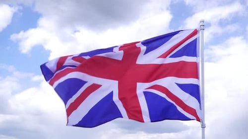 British Flag Waving Against a Cloudy Sky