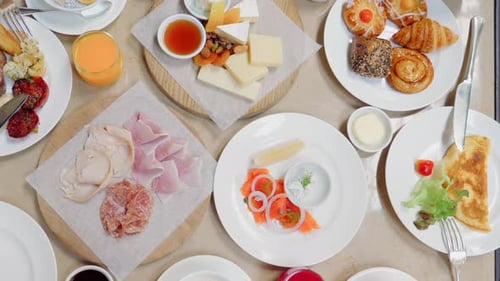 Table Full of Delicious Food Cheese Salmon Ham Bakery and Juices