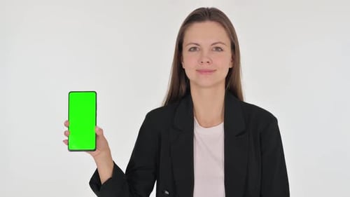 Casual Young Woman Showing Smartphone with Green Screen on white Background